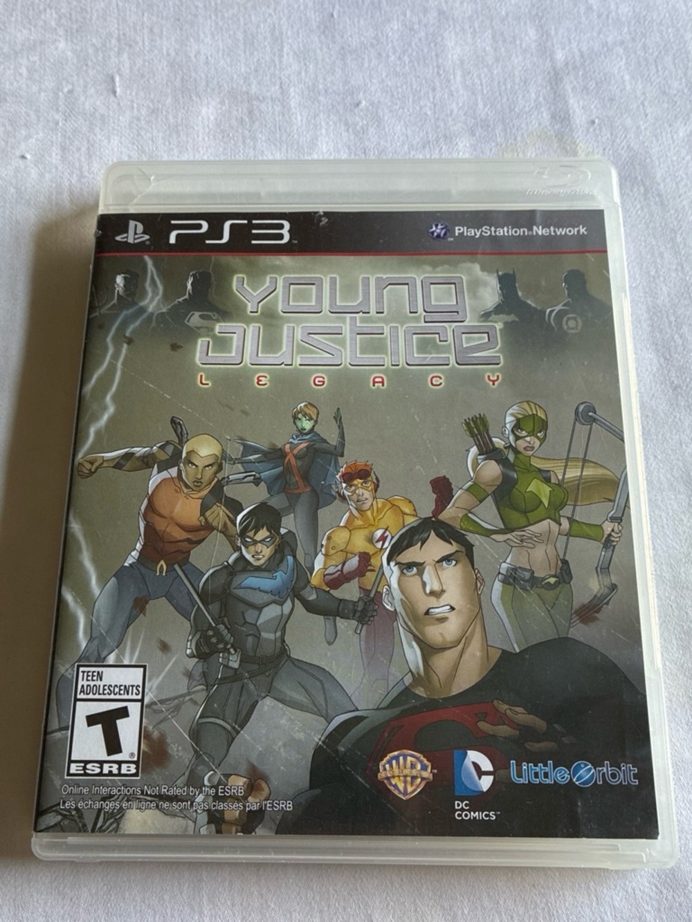 Justice Young Justice Legacy PS3 Game Cover — Green, Black, Gray, Blue